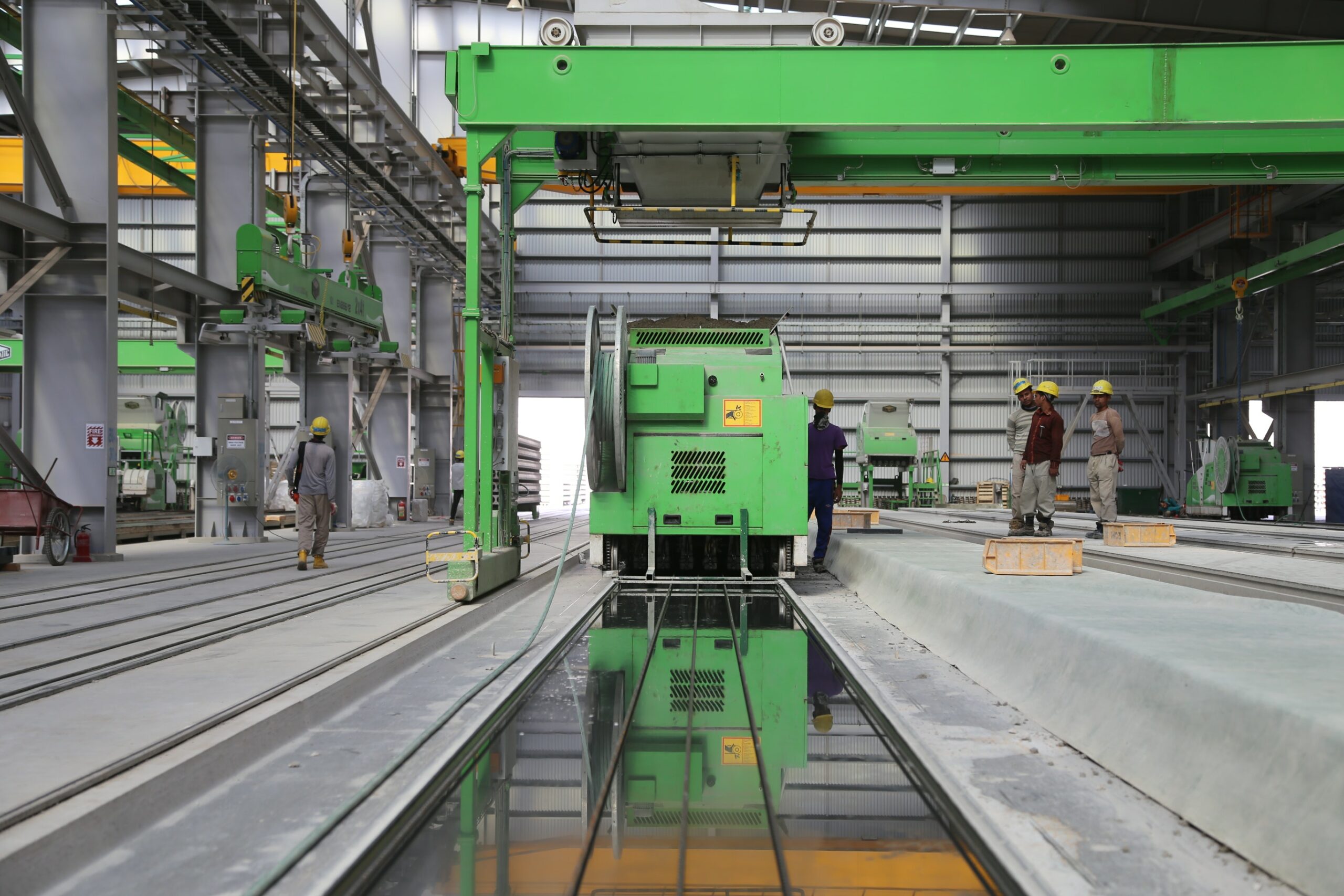 green factory machines and factory workers | Economic Empowerment & Entrepreneurship | Doorways