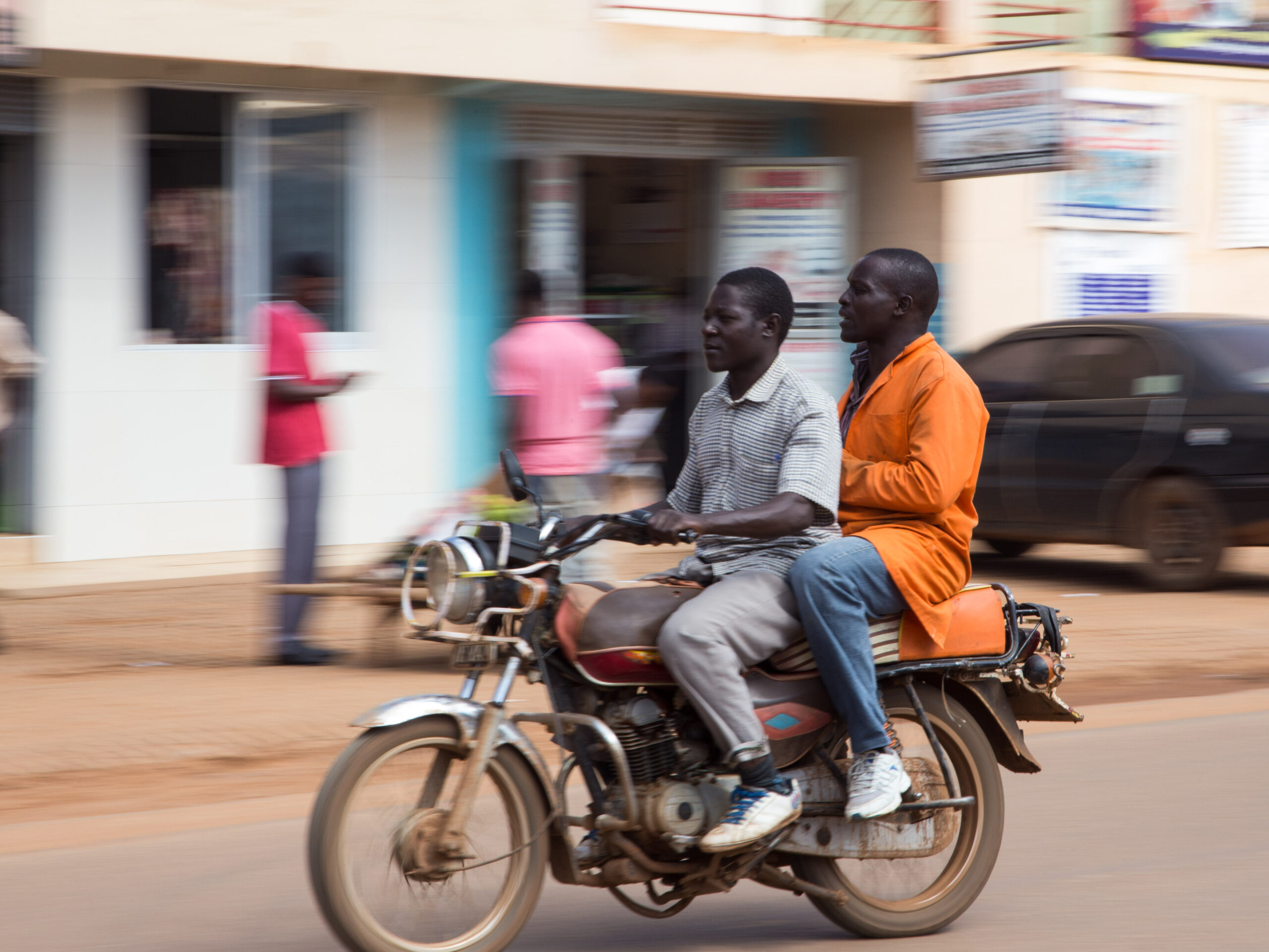 two man on a motorbike in uganda | Economic Empowerment & Entrepreneurship | Doorways